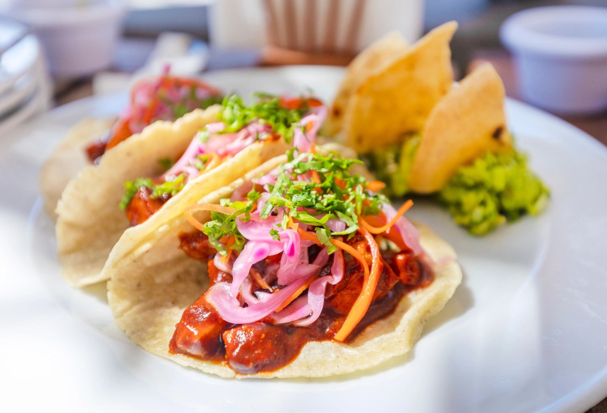 Mexican stew with guacamole garnish